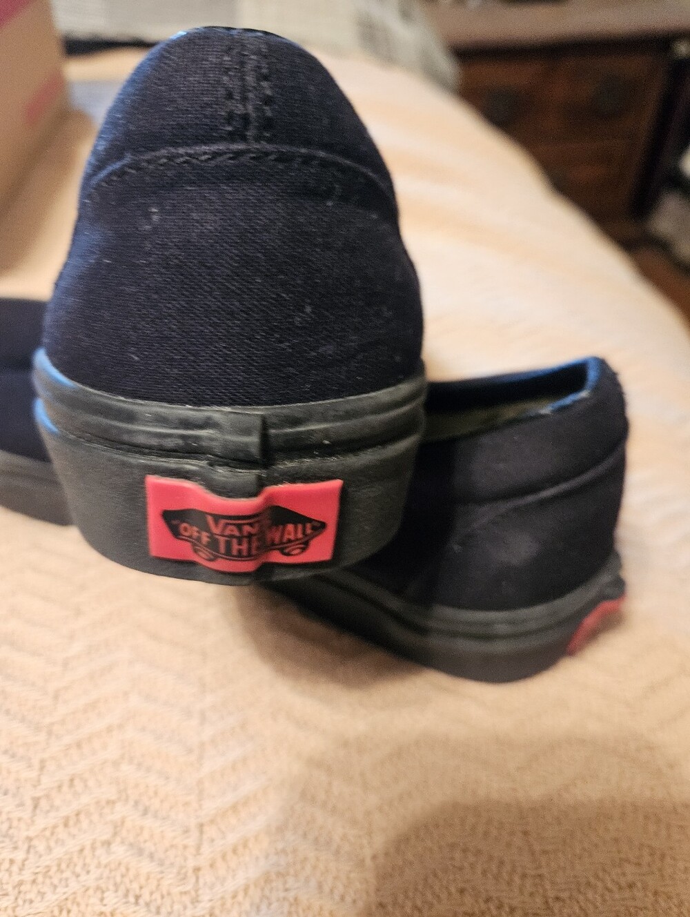 Vans Black Canvas Slip-On with Red Heel Logo
